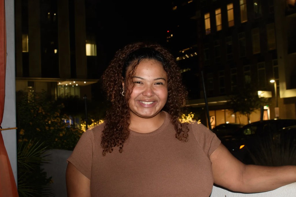 Briana Zive, 27, a program specialist for a nonprofit, poses for her picture after a Trump-Harris debate watch party at the LGBTQ+ bar Kobalt in downtown Phoenix on Sept. 10, 2024.