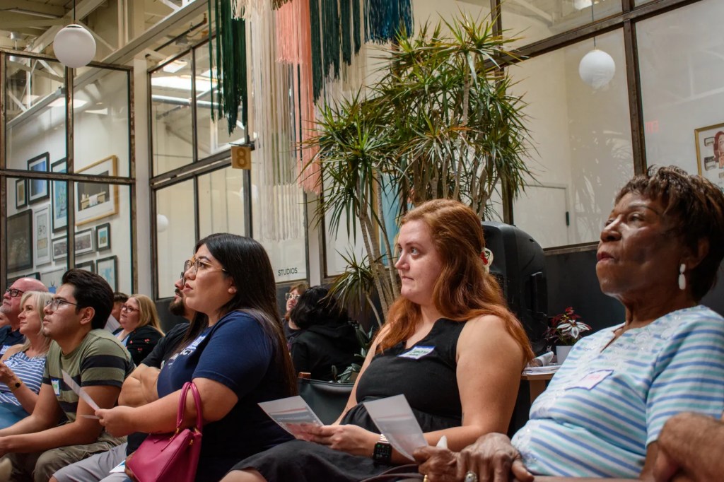 Cameron Adams, 24, an Arizona State University graduate who works for a congressional campaign watches the Trump-Biden debate in downtown Phoenix with the local progressive group Progress Arizona on June 27, 2024.