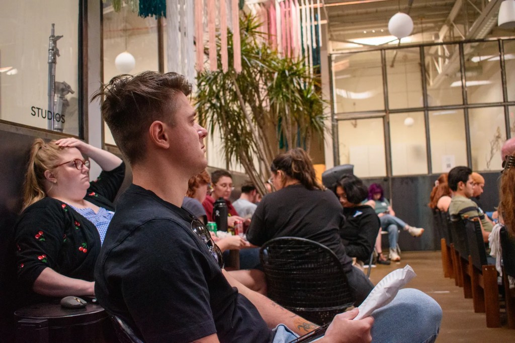 Darko Paravac, 27, a Progress Arizona volunteer, watches the Trump-Biden debate in downtown Phoenix with the local progressive group Progress Arizona on June 27, 2024.