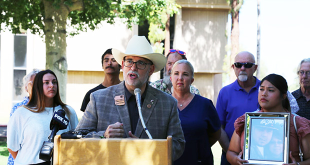 State Senator David Livingston speaks at a news conference in the rose garden of the Arizona capitol with Senate Bill 1581 supporters standing behind him on June 16, 2022.