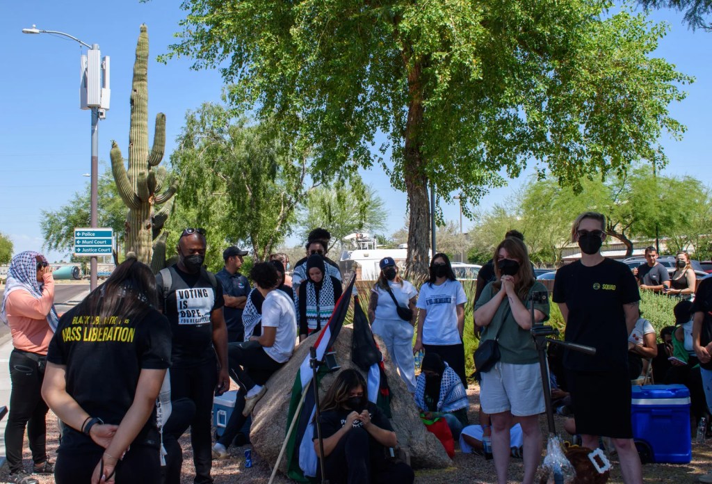People wait for a judge's verdict outside the Ocotillo Regional Court Center in Chandler, Arizona, with the abolitionist group Mass Liberation Arizona on May 14, 2024.