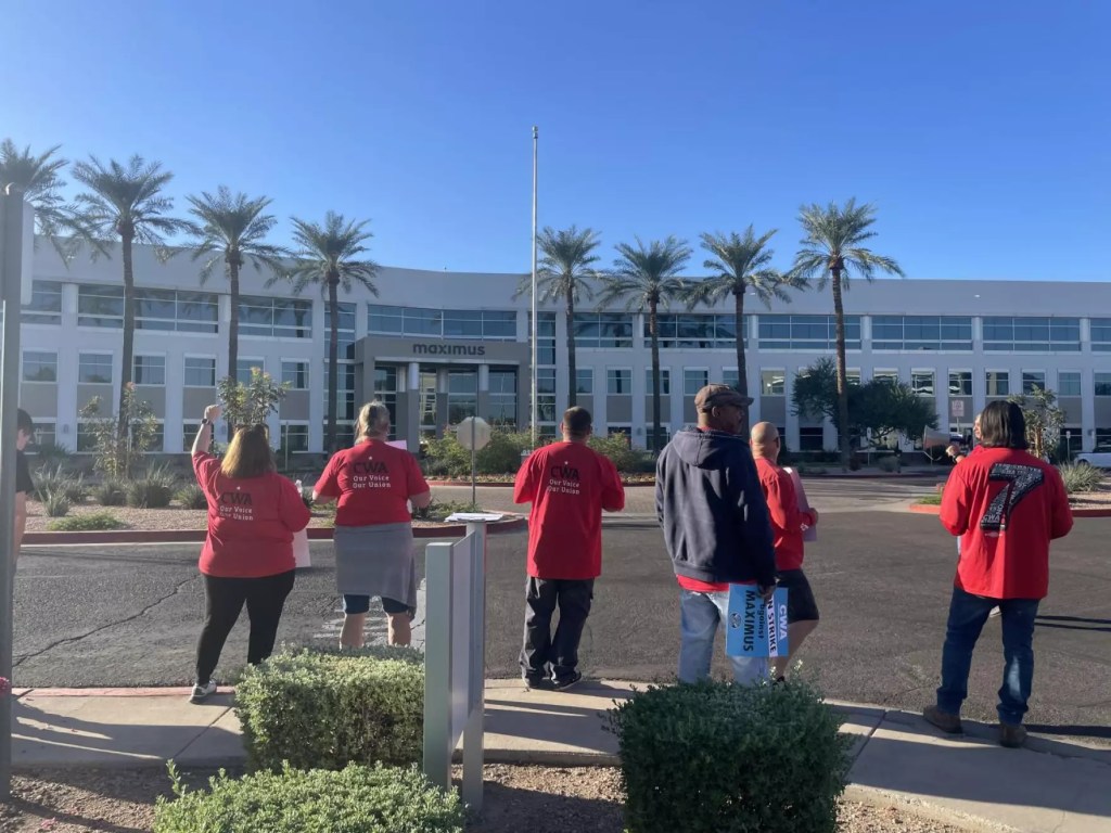 Maximus employees picket outside a call center in Phoenix.