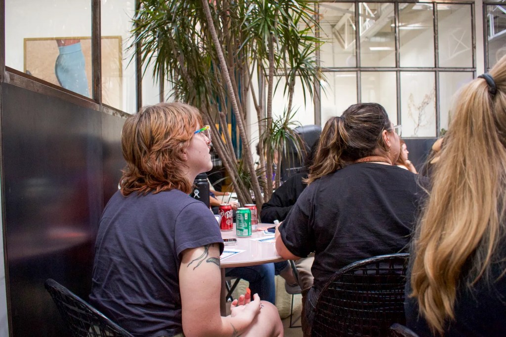 Quin Quinlan, 23, a senior at Northern Arizona University, watches the Trump-Biden debate in downtown Phoenix with the local progressive group Progress Arizona on June 27, 2024.